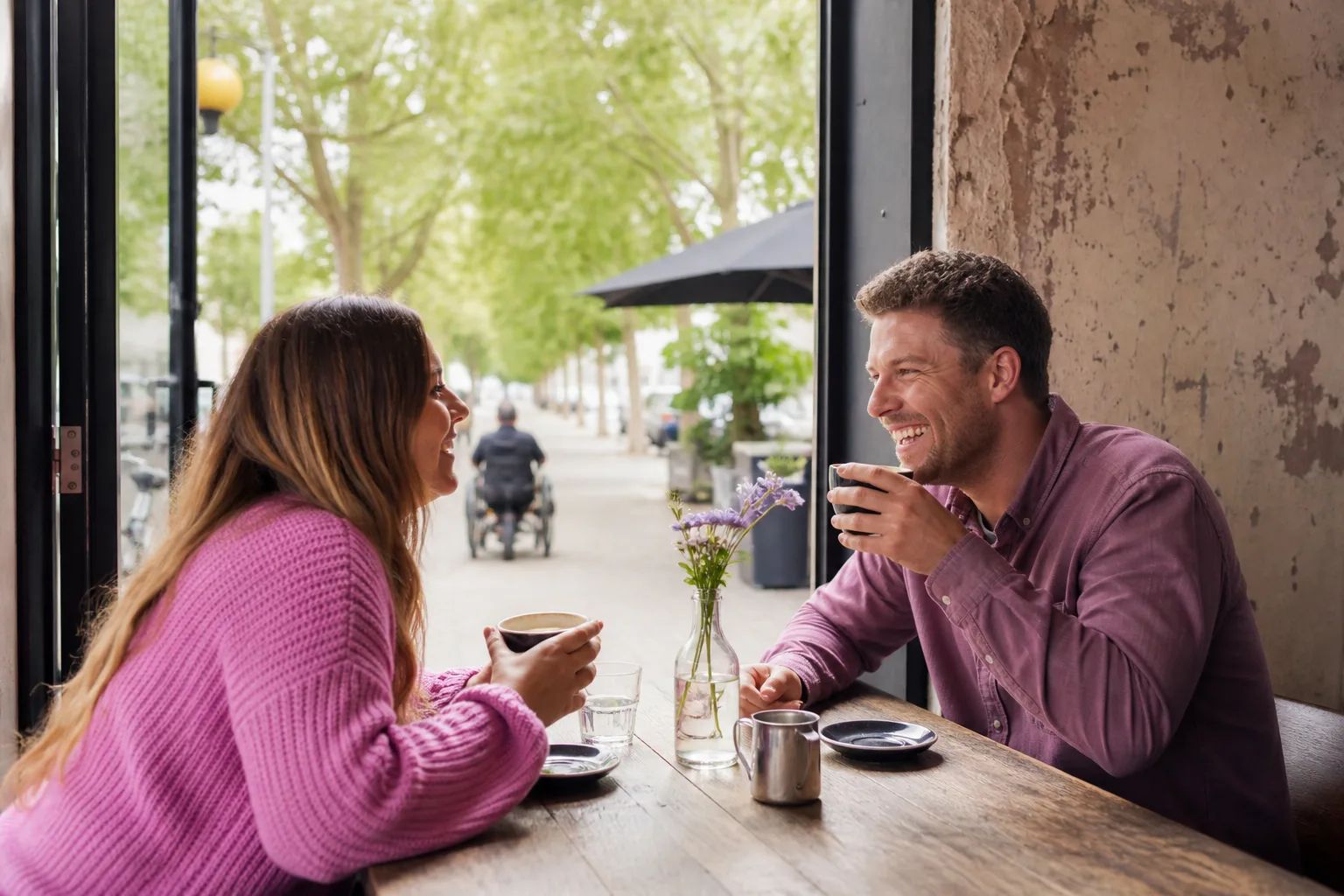 Two people talking beside the waterfront on the Isle of Wight
